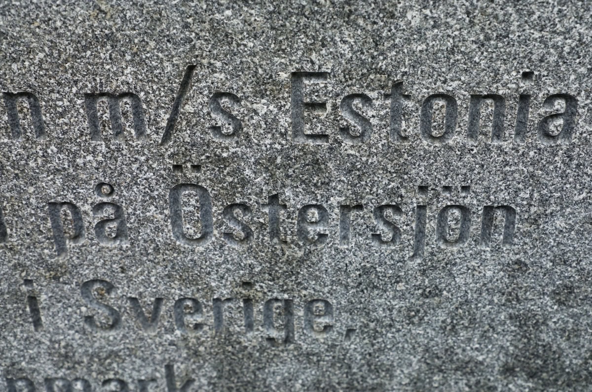 Close-up photo of an engraved stone featuring Swedish text with the words