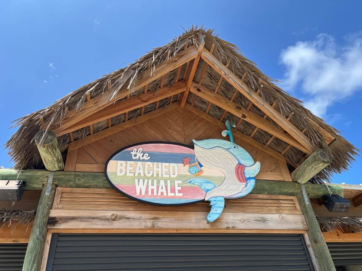 A wooden restaurant sign reading
