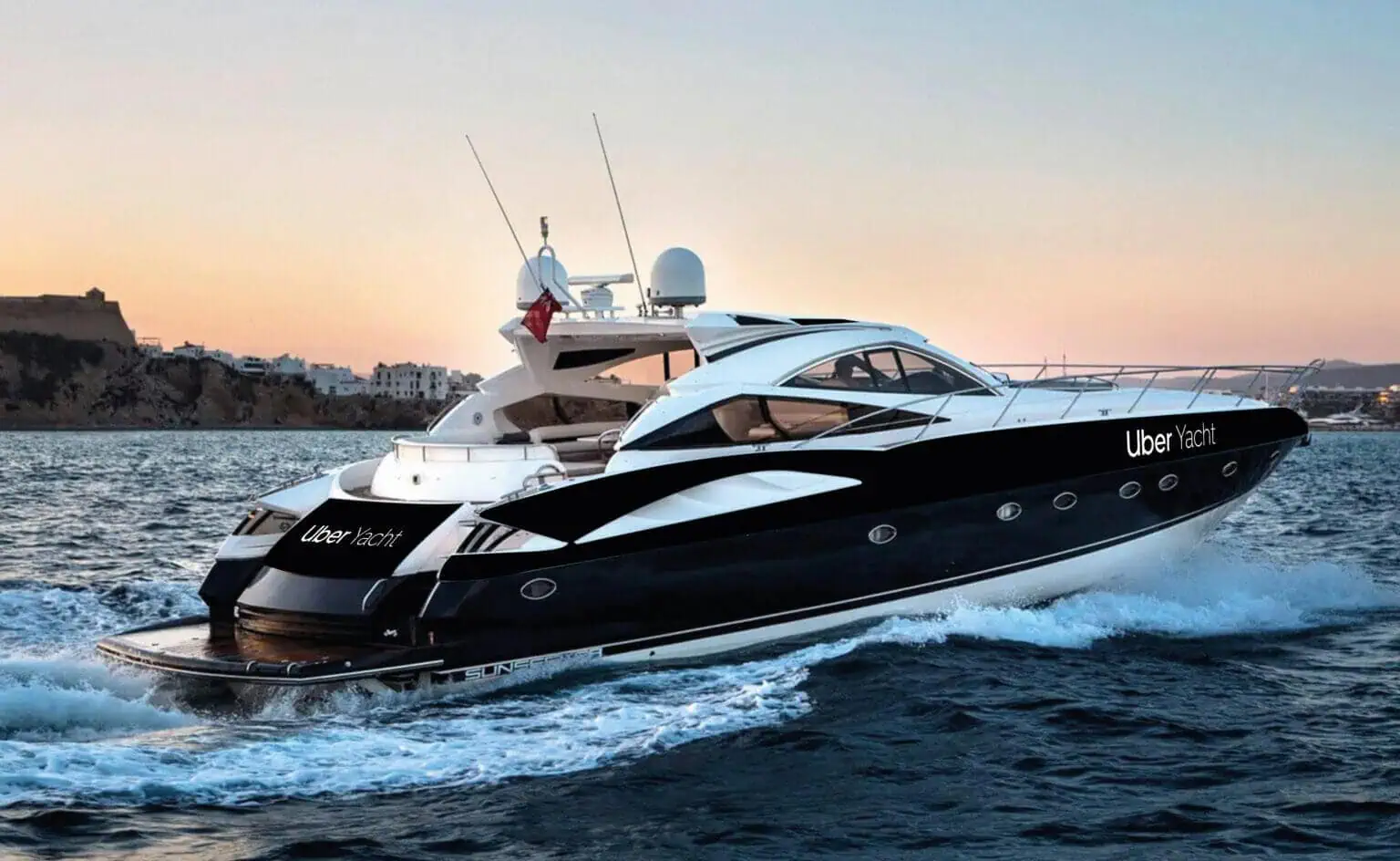 A sleek black and white yacht named